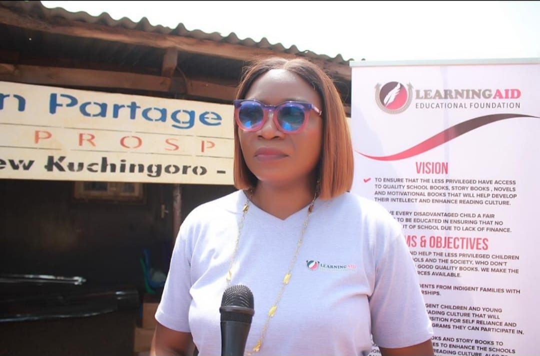 An LEF volunteer speaking at the New Kuchigoro IDP camp outreach, Abuja.